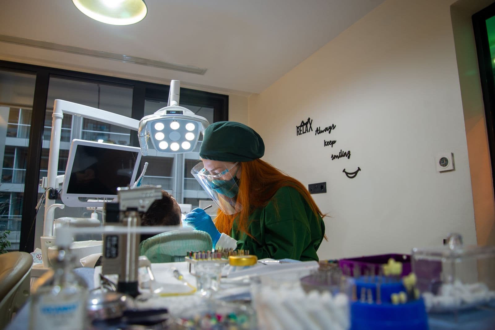 Friendly phlebotomist performing a routine sample collection
